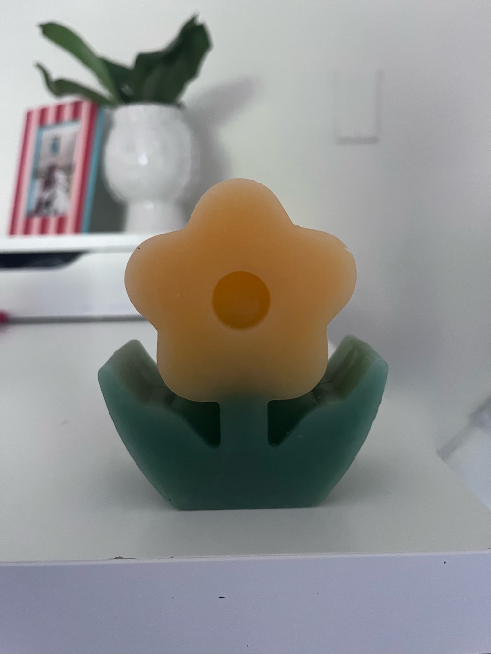 Flower-Shaped Decorative Candle - Green Base and Amber Bloom